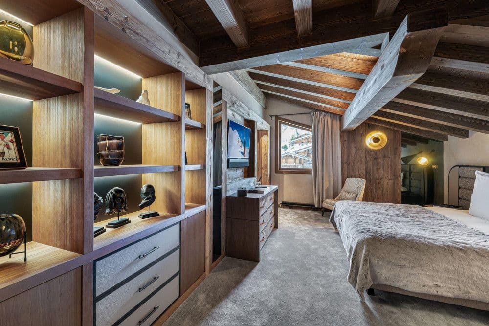Bedroom with built-in shelving under the eaves at Mont d'Arbois 6