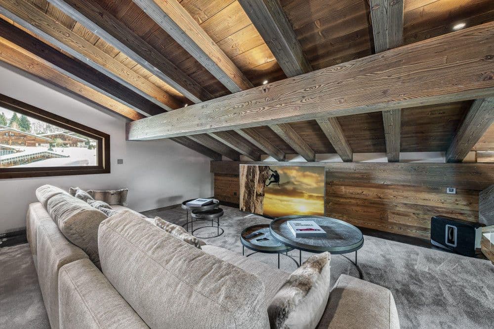 Snug lounge beneath old timber beams at Mont d'Arbois 6