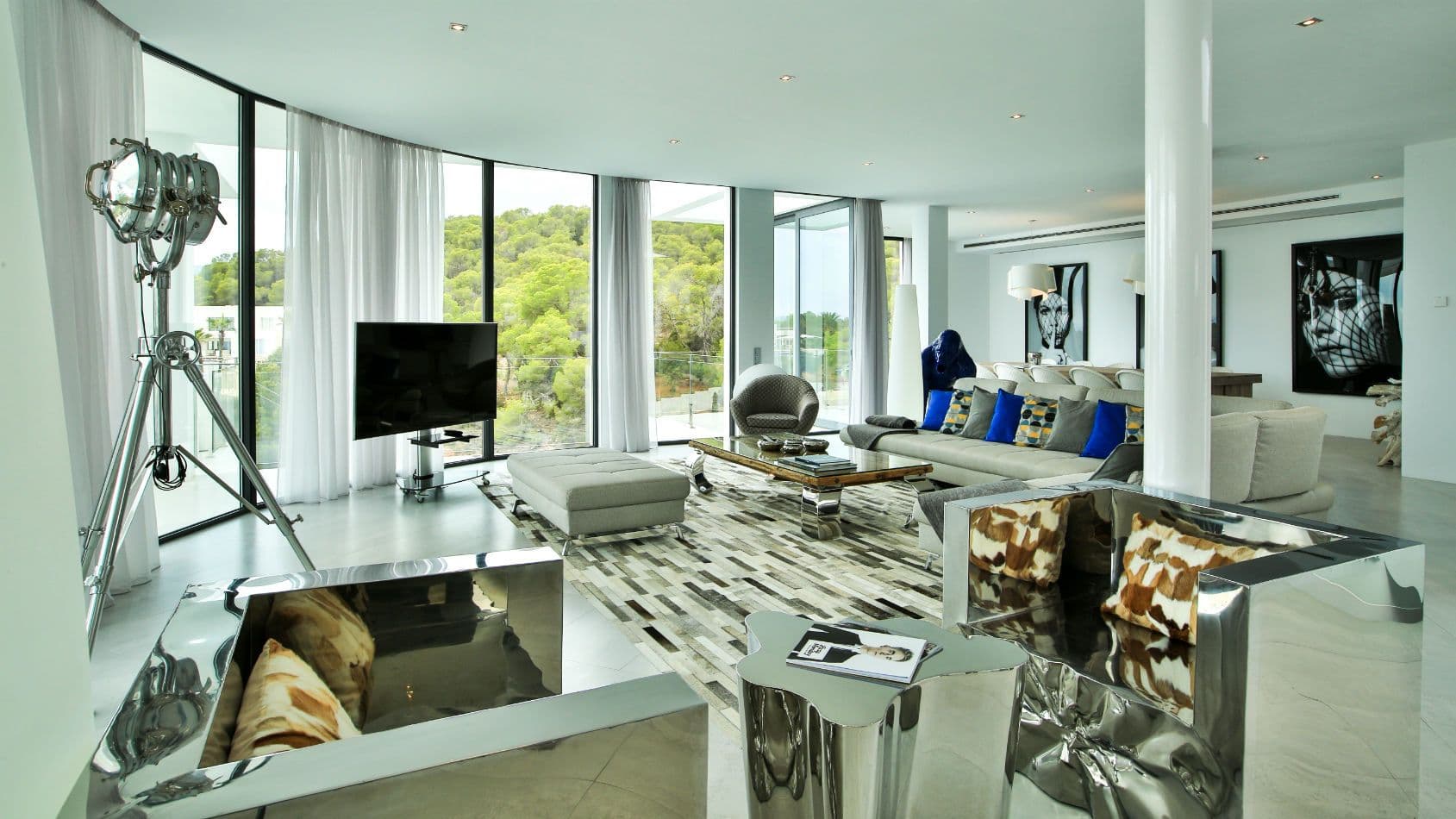 Media lounge with a television, film light and blue accents at Baby, You Can Drive My Car, Ibiza