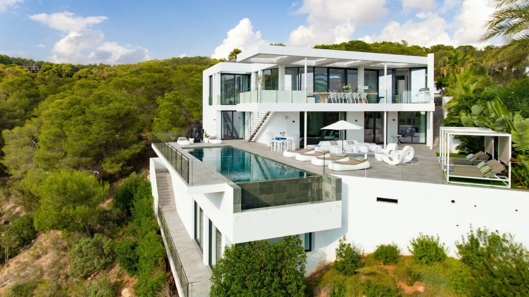 Contemporary white villa with an infinity pool set in pine forest at Baby, You Can Drive My Car, Ibiza