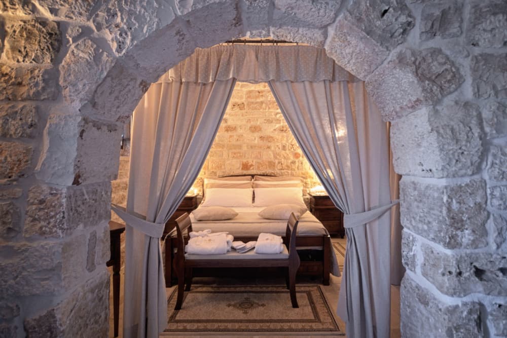 Sublimia trullo bedroom with canopy bed, Ceglie Messapica, Apulia, Italy