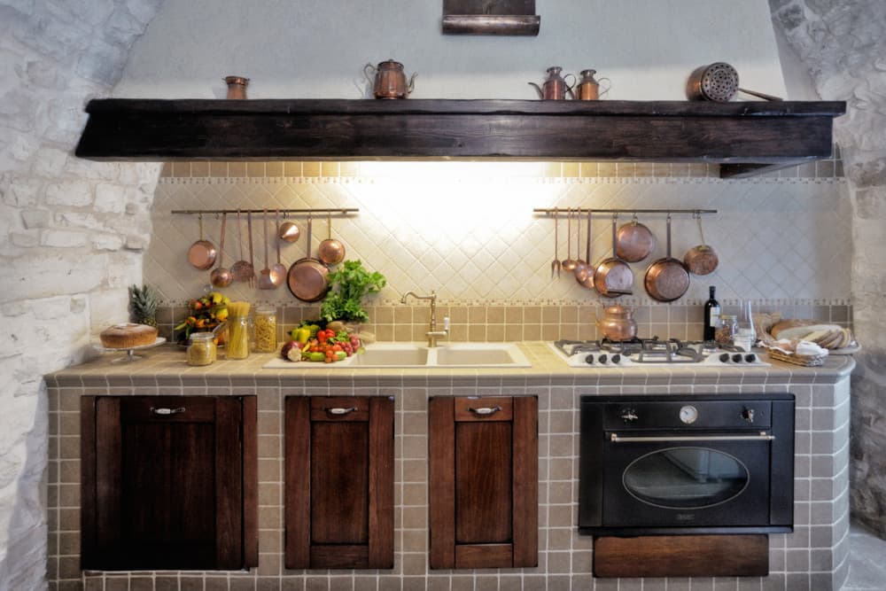 Sublimia country kitchen with copper pots and tile work, Ceglie Messapica, Apulia, Italy