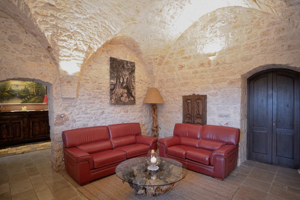 Sublimia main lounge with stone vaults and leather seating, Ceglie Messapica, Apulia, Italy