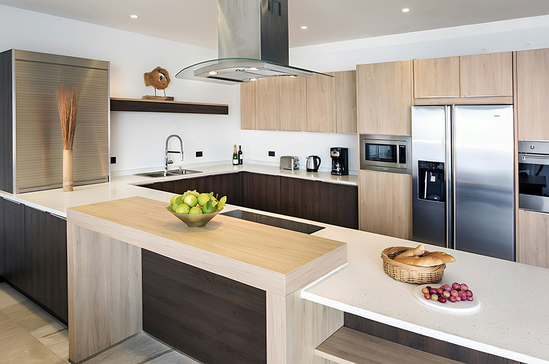 Timber and white kitchen with an island and breakfast bar at Hills of Antigua