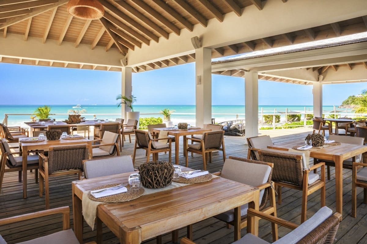 Open-sided resort restaurant over the beach at Hills of Antigua