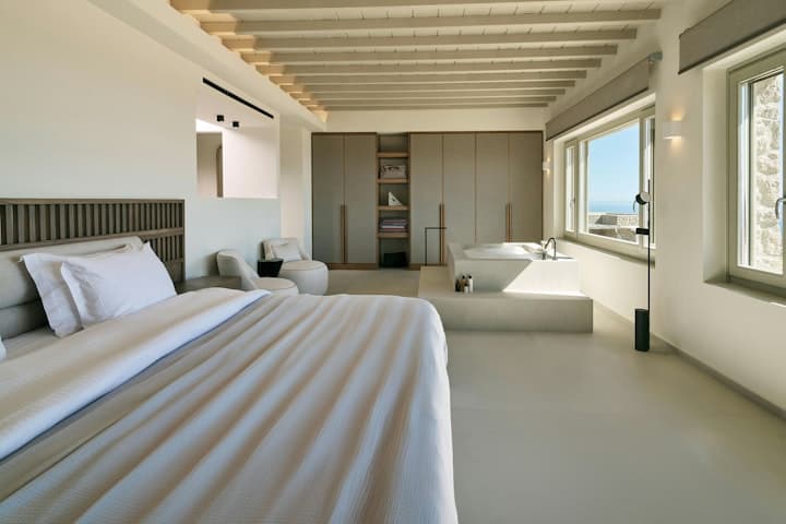 Sea Washed Wonder master bedroom with bathtub and sea views, Mykonos, Greece