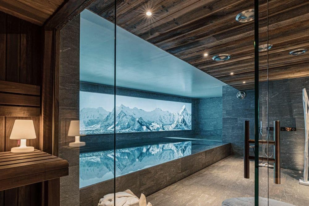 Timber sauna with a mountain mural at Le Fornet 2