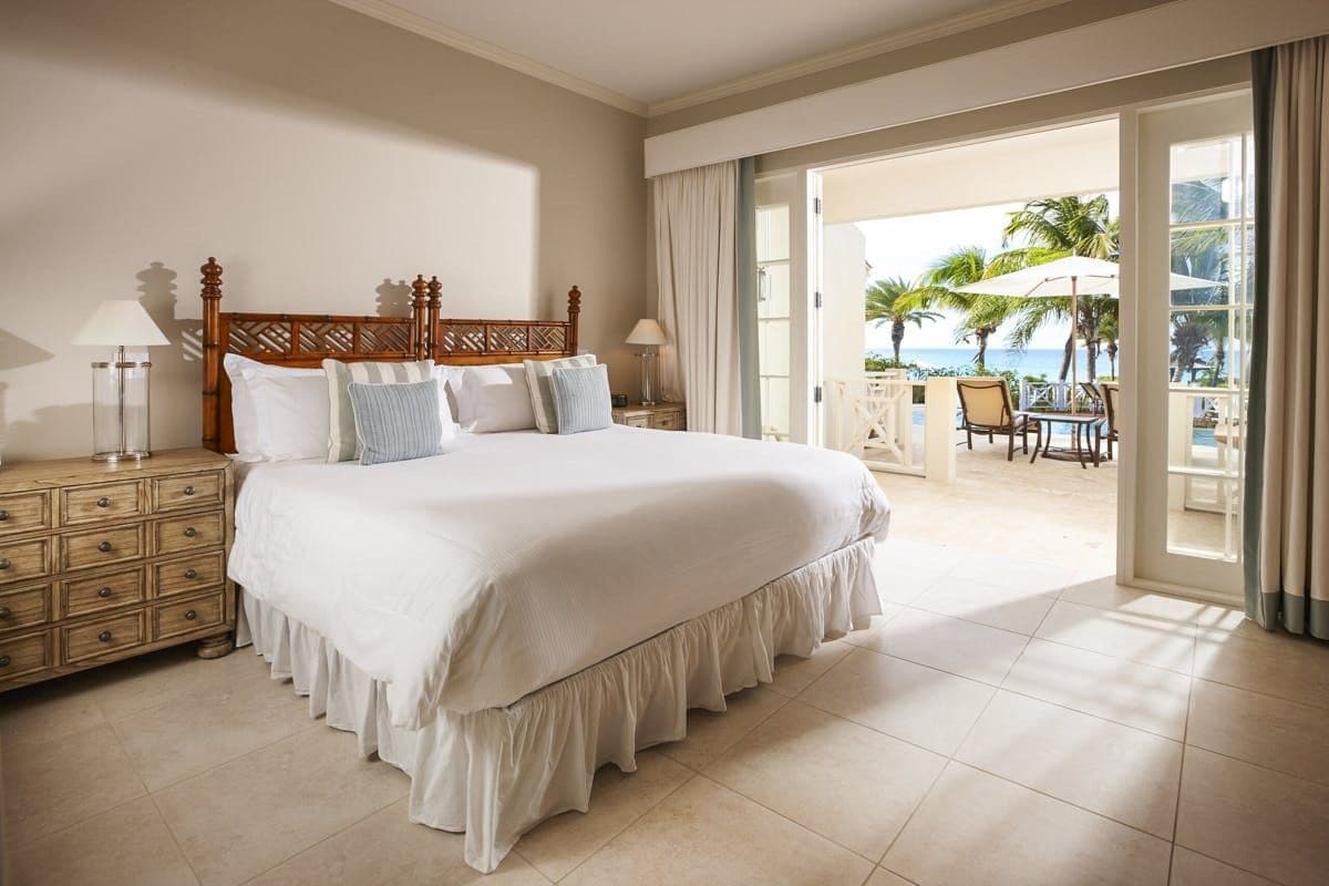 Bedroom with terrace access and sea view at Caribbean Wonder
