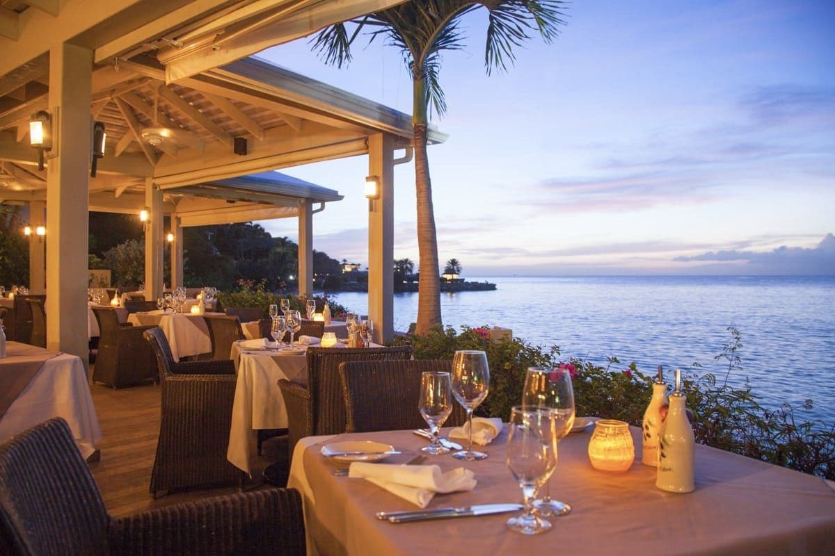 Clifftop restaurant at dusk overlooking the sea at Caribbean Wonder