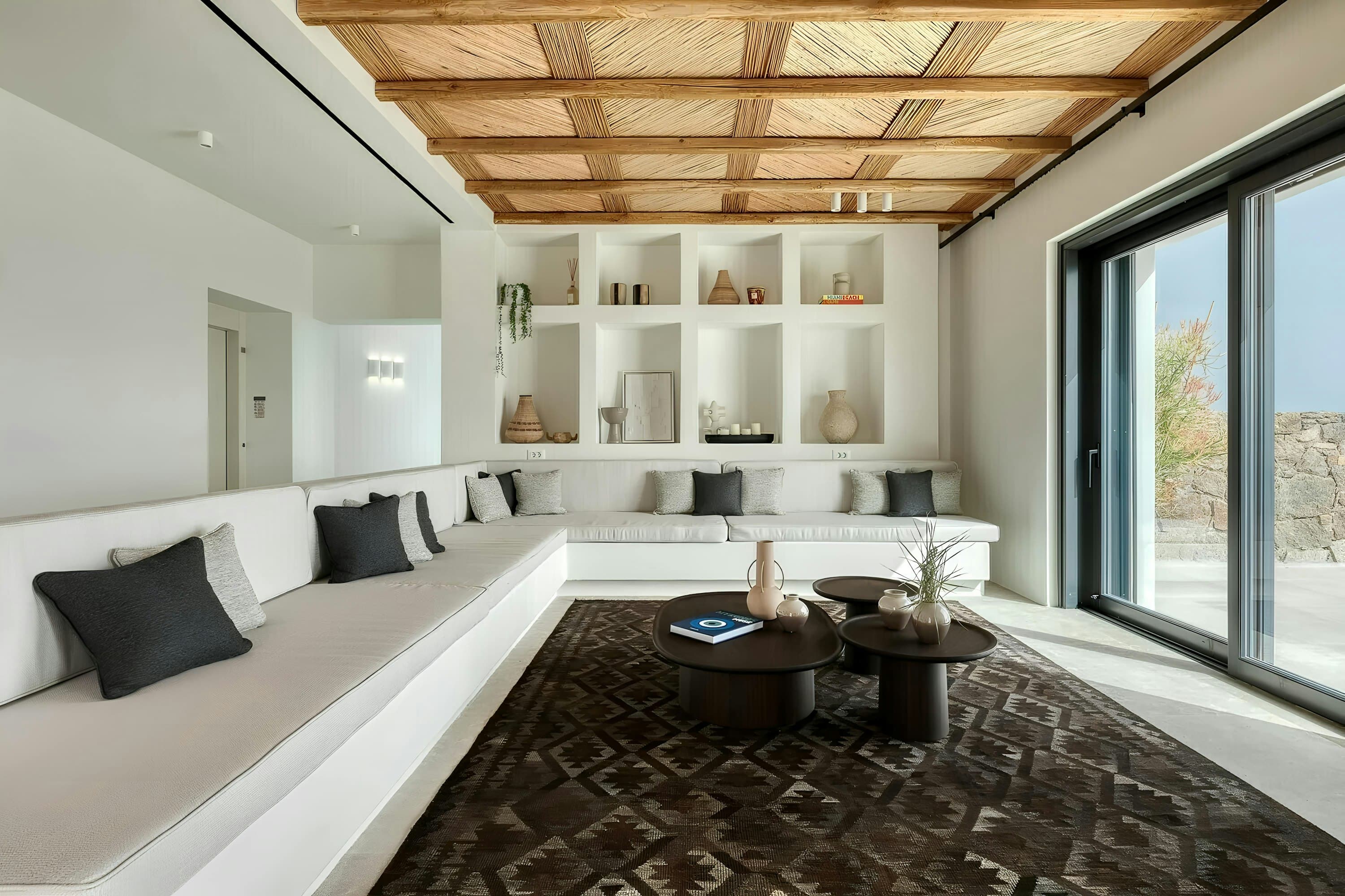 Aegean Beauty living room with traditional woven ceiling and built-in seating, Mykonos, Greece
