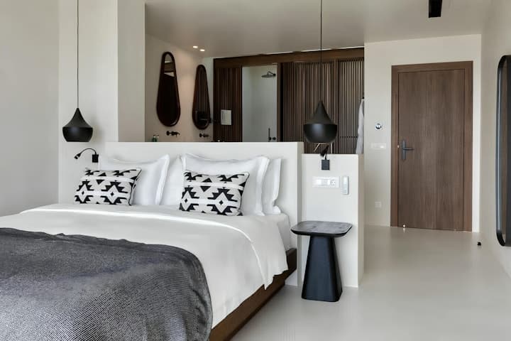 Aegean Beauty master bedroom suite with integrated bathroom and freestanding tub, Mykonos, Greece