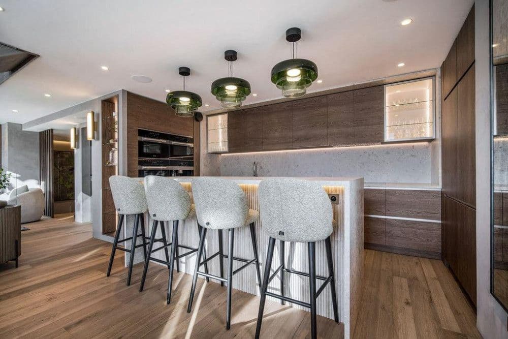 Design kitchen with an island and breakfast stools at Saint Martin de Belleville 12