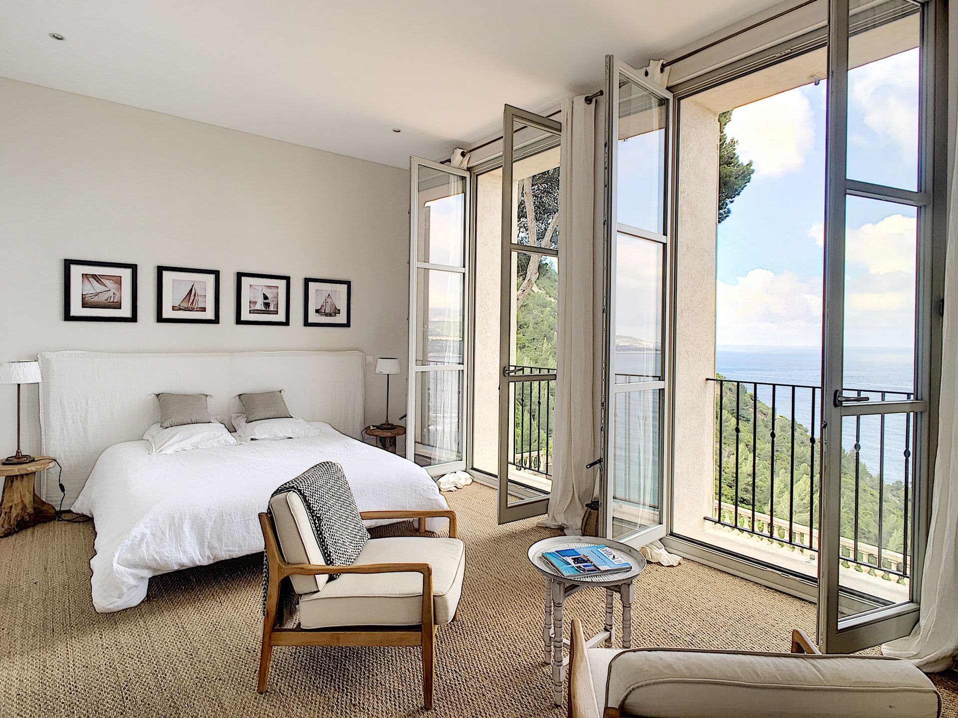 En-suite with a tub beside doors to a balustraded sea terrace at Be Our Guest, Cassis, France