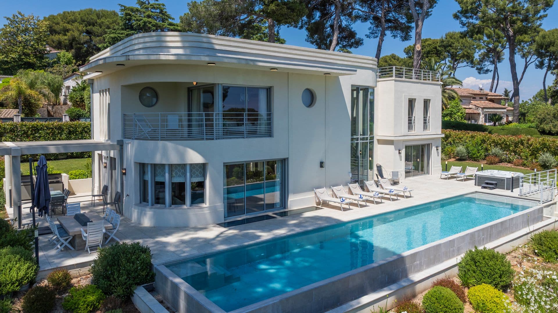 Curved Art Deco facade and poolside sun terrace at Above Antibes, Cap d'Antibes