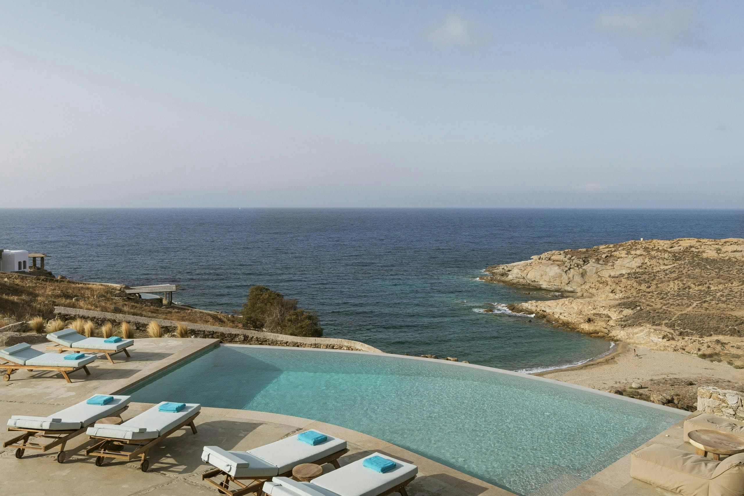 Oasis Dawn infinity pool overlooking Aegean Sea, Kalafati, Cyclades Islands, Greece