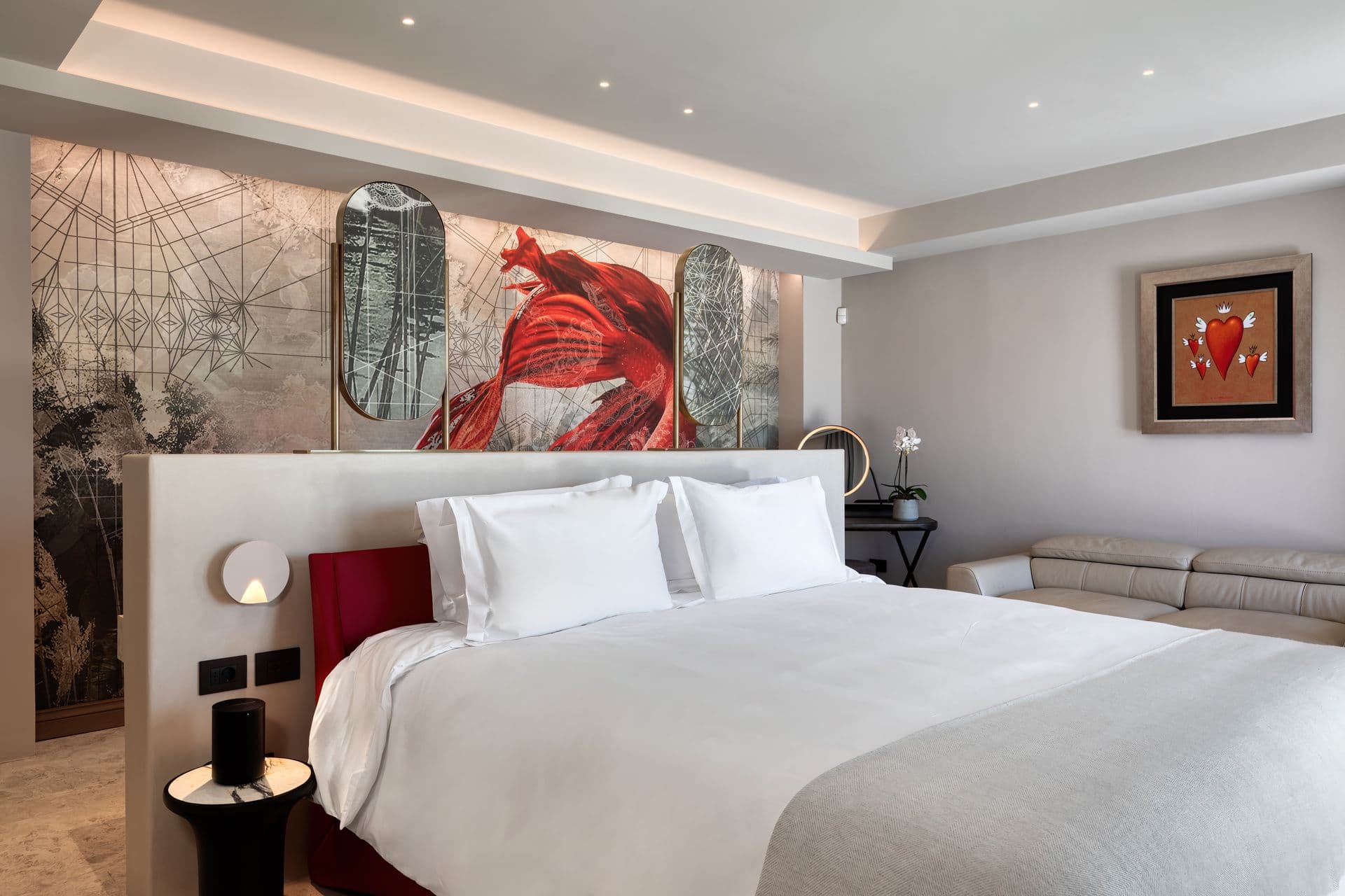 Double bedroom with a bold red artwork above the bed at Aegean Aspect, Mykonos