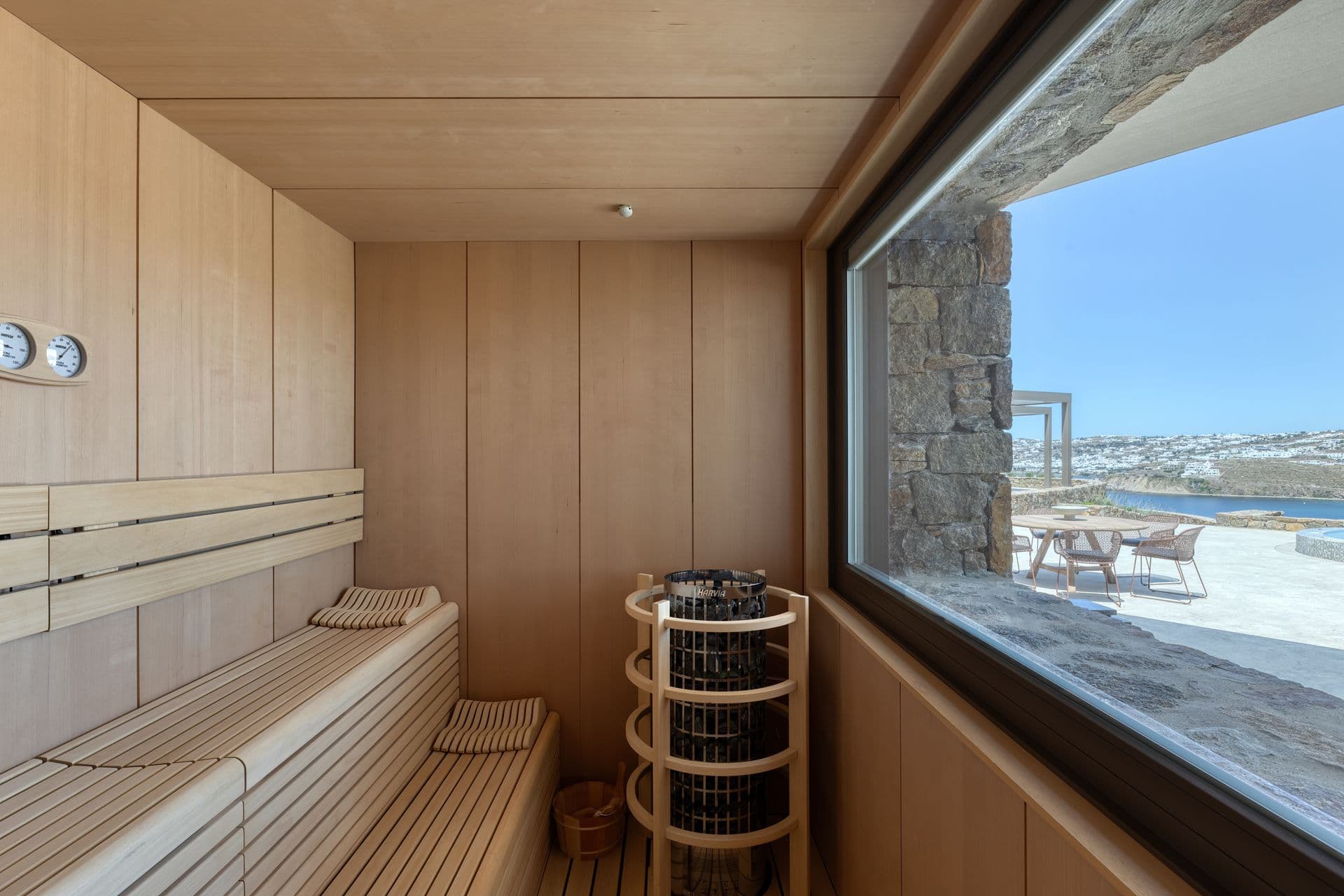 Timber sauna with a picture window to the terrace at Aegean Aspect, Mykonos
