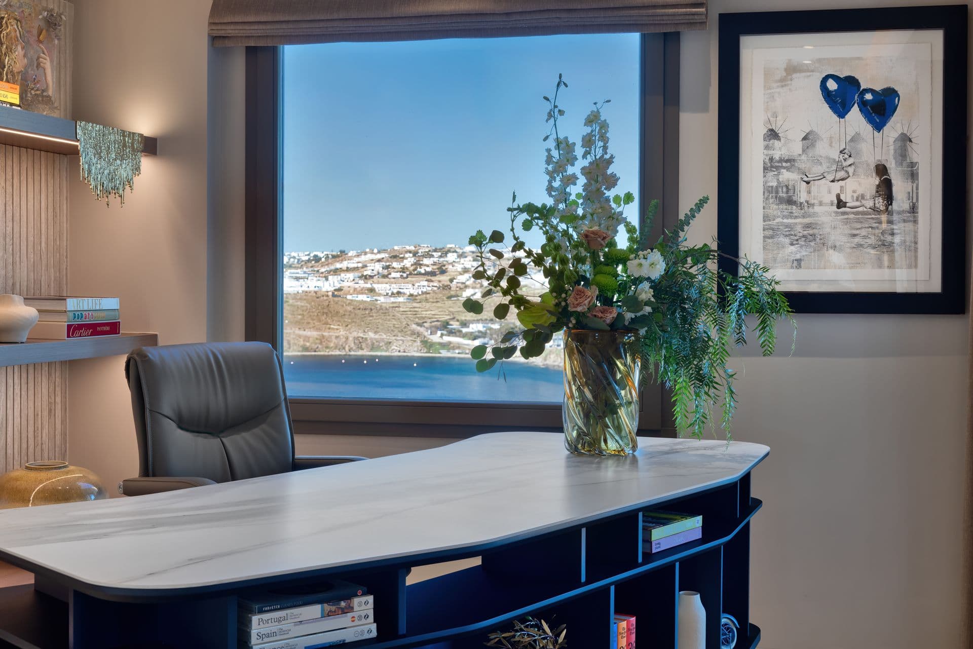 Study with a marble desk and a picture window over the island at Aegean Aspect, Mykonos