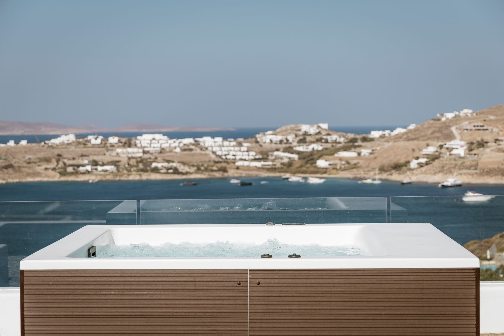 Outdoor jacuzzi at Goddess of the Clouds with panoramic sea views.
