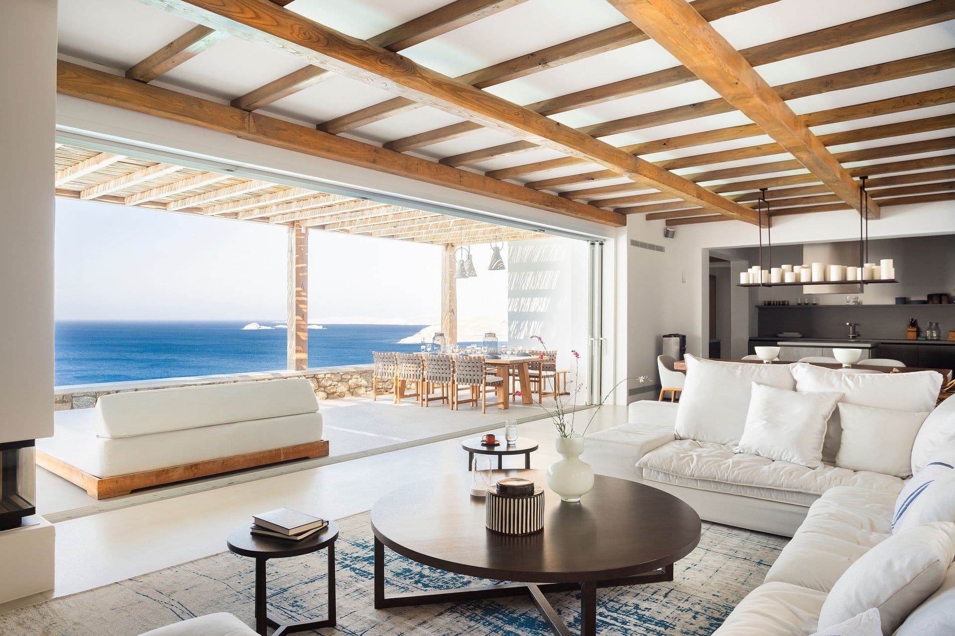 Living room opening onto the terrace at Goddess of the Clouds, with sweeping sea views.
