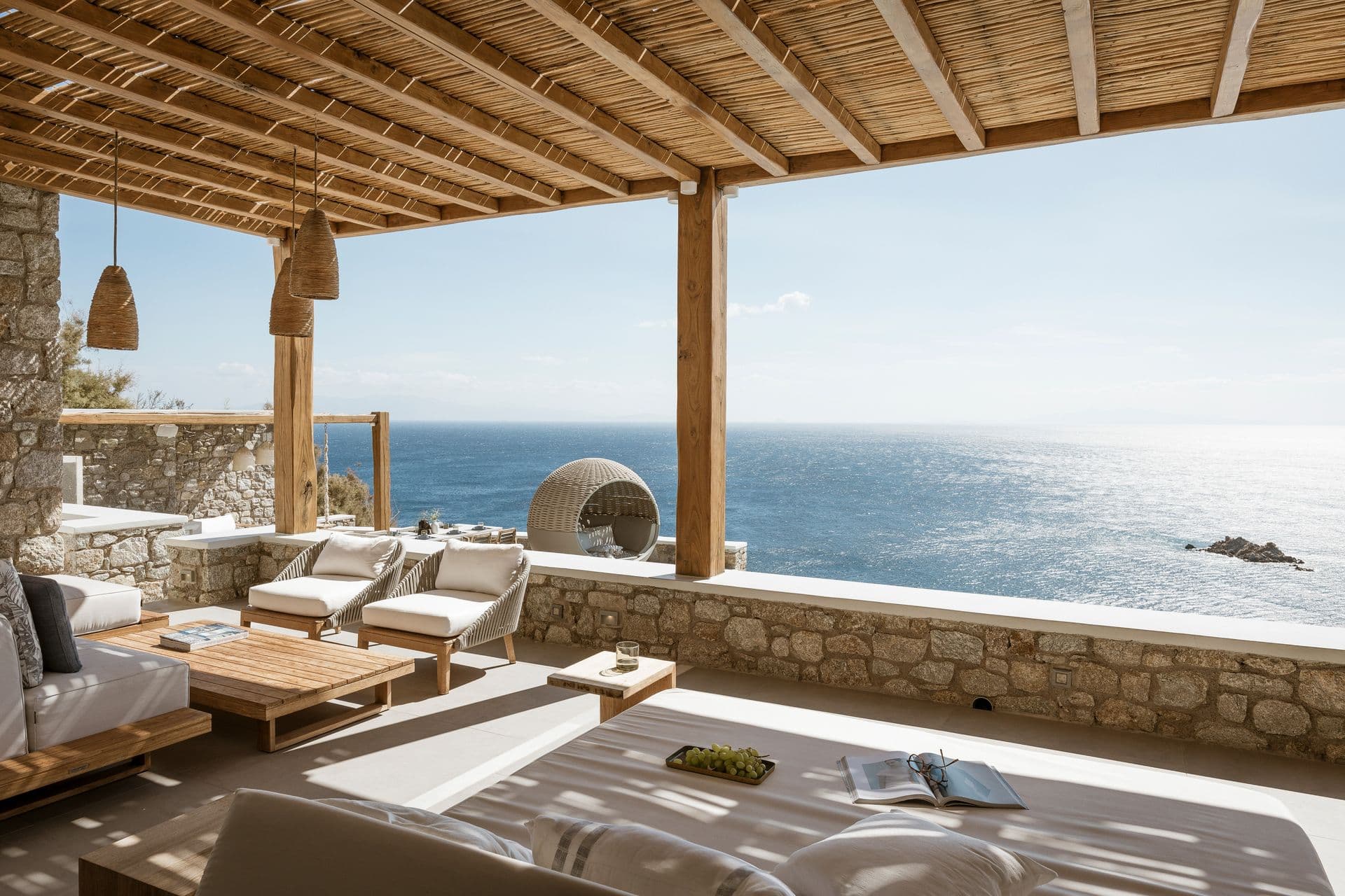 Covered terrace lounge at Goddess of the Clouds looking out over the water.