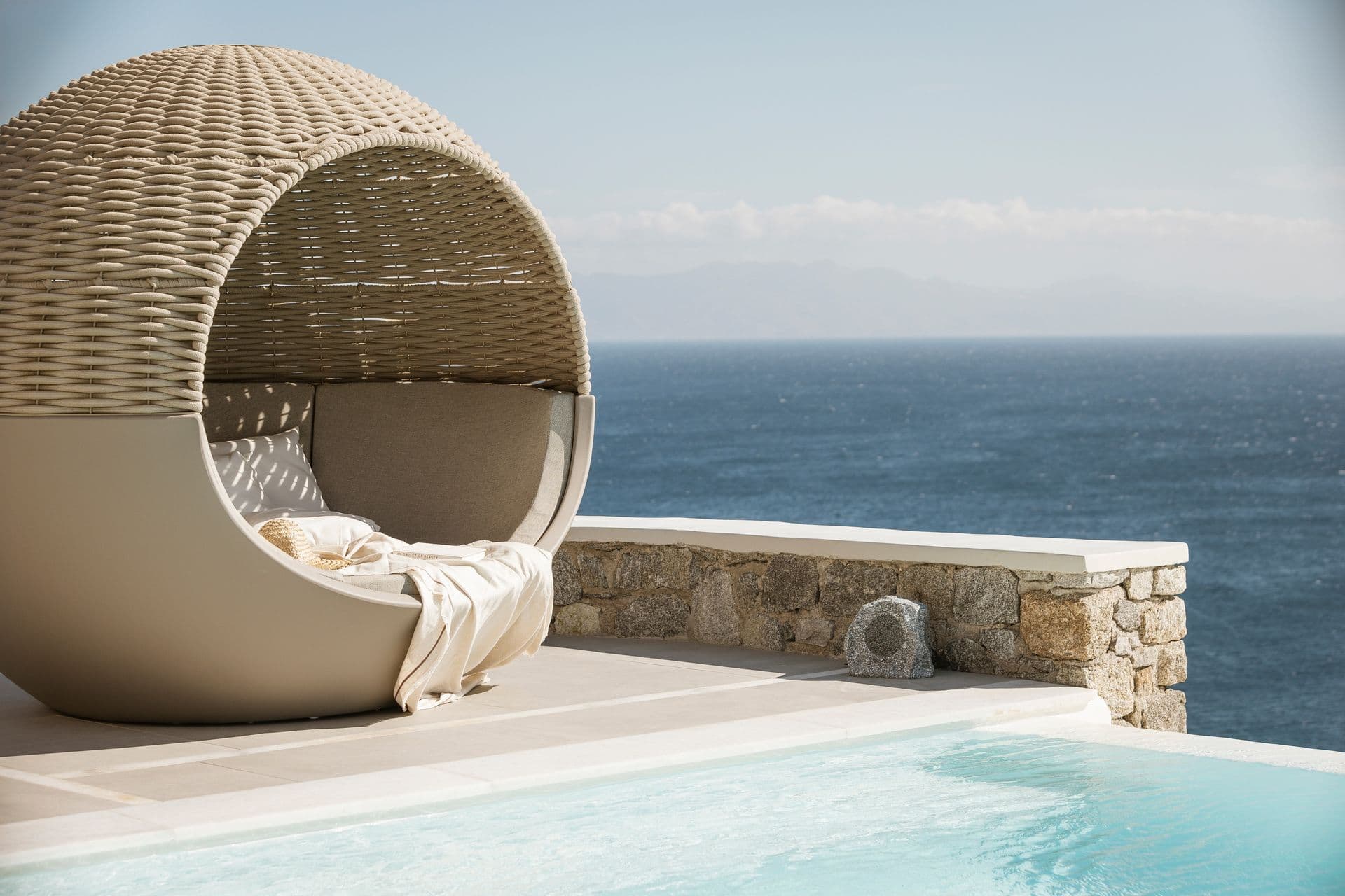 A round daybed beside a small plunge pool at Goddess of the Clouds.