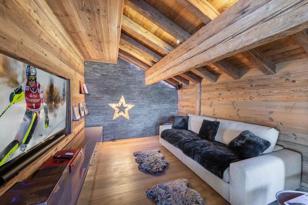 Media room with a large TV at Courchevel 26