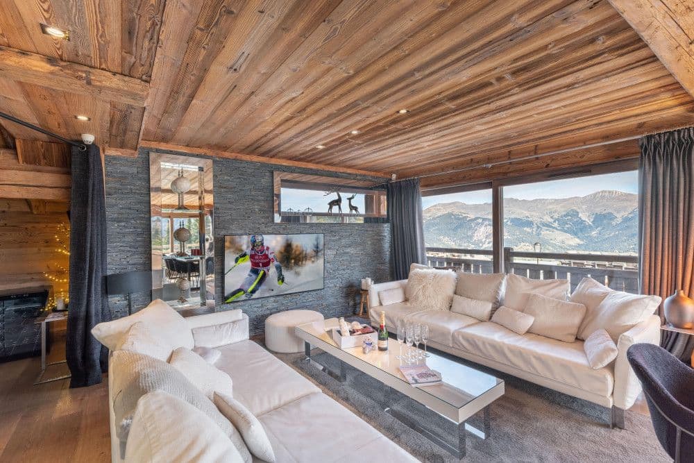 Fireside sitting room with mountain views at Courchevel 26