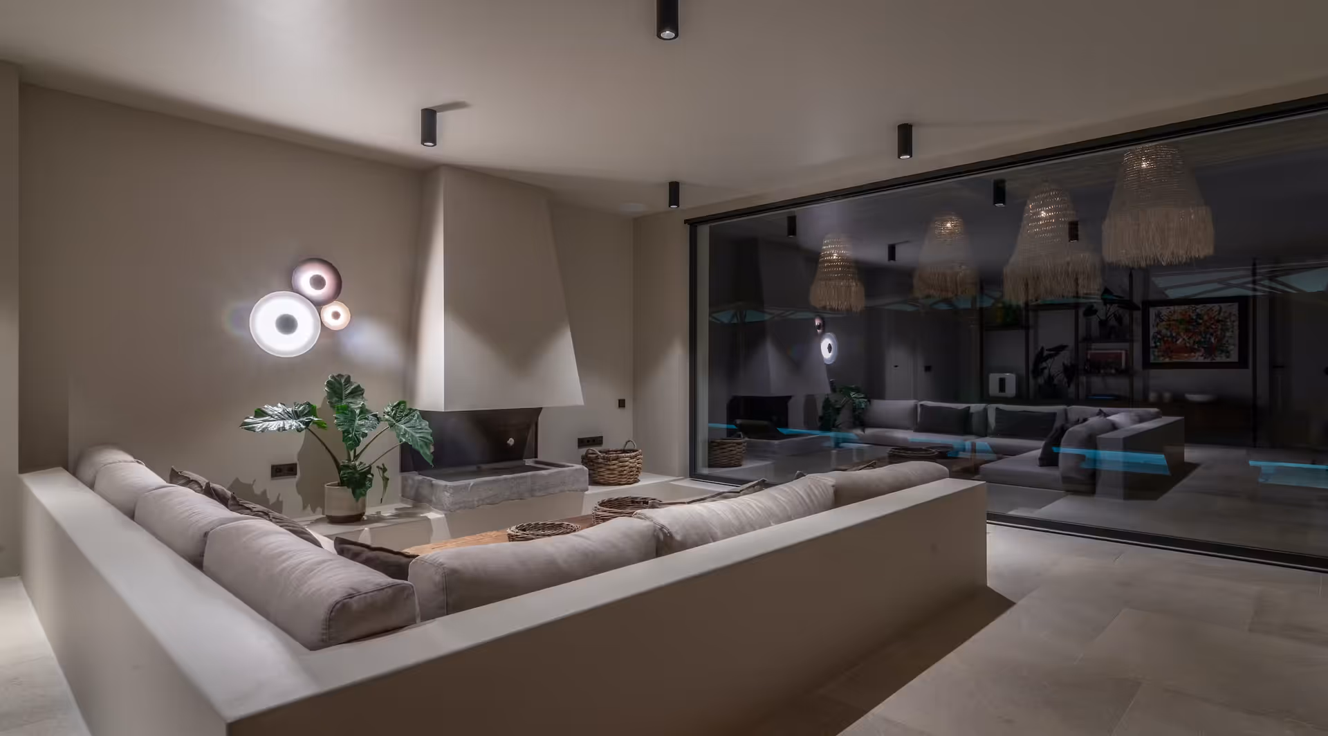 Living area corridor with glass walls framing sea views on both sides