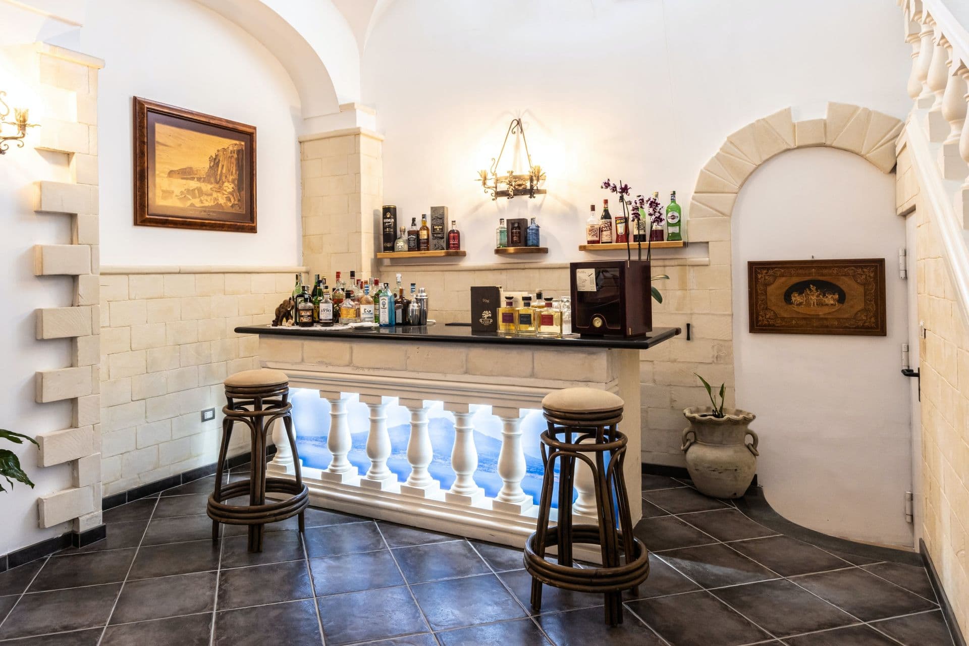Vaulted bar room with stocked shelving at Pavillion Paradiso