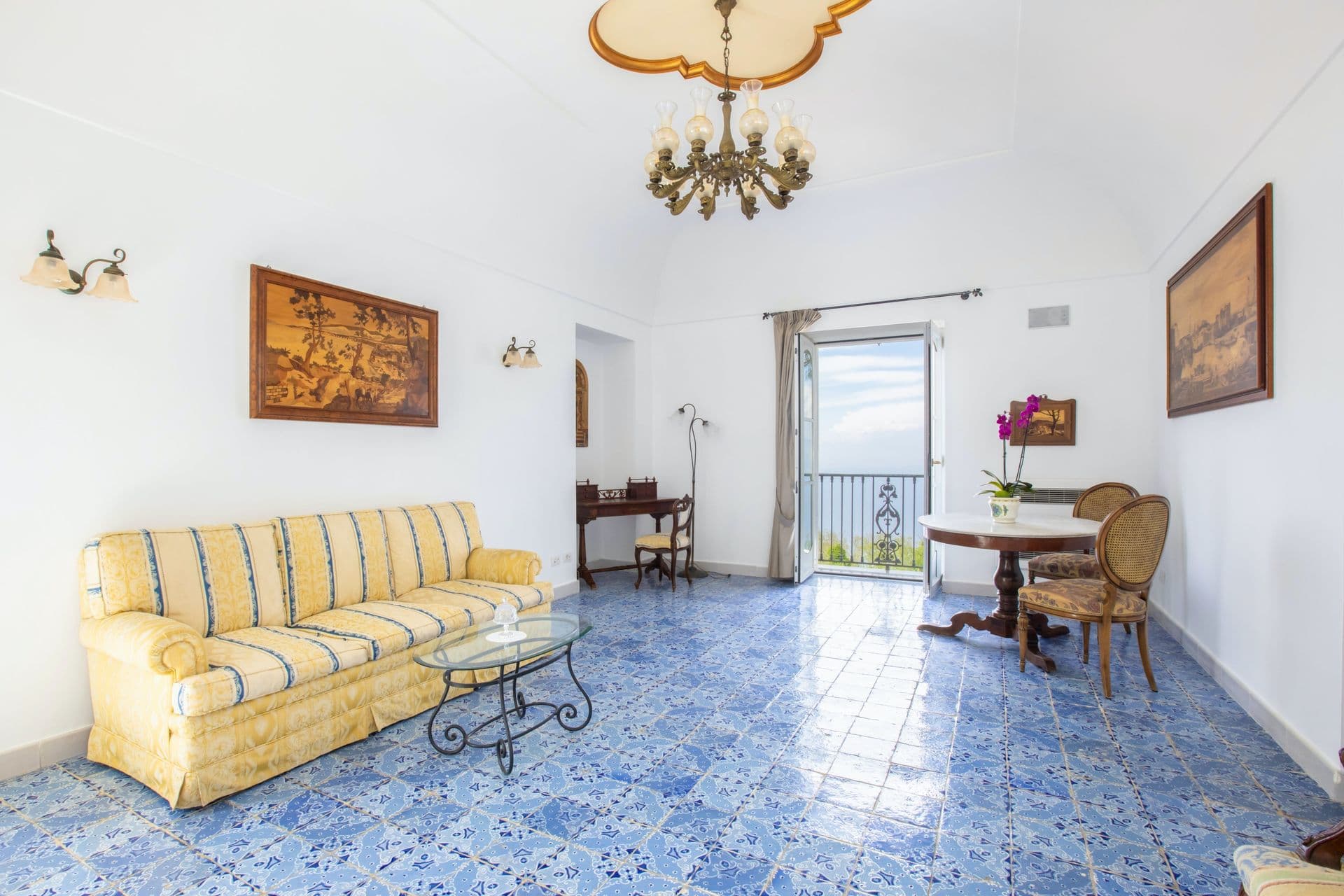 Grand salon with blue majolica-tiled floor at Pavillion Paradiso