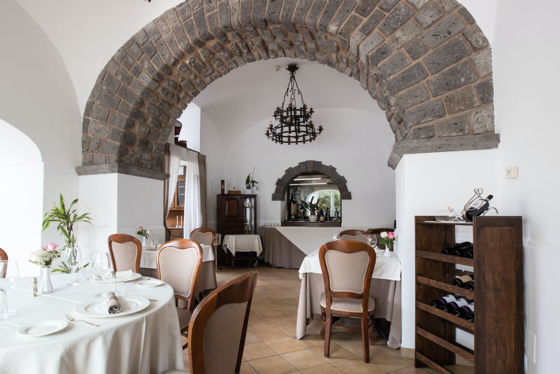 Formal dining room under a stone vaulted ceiling at Pavillion Paradiso