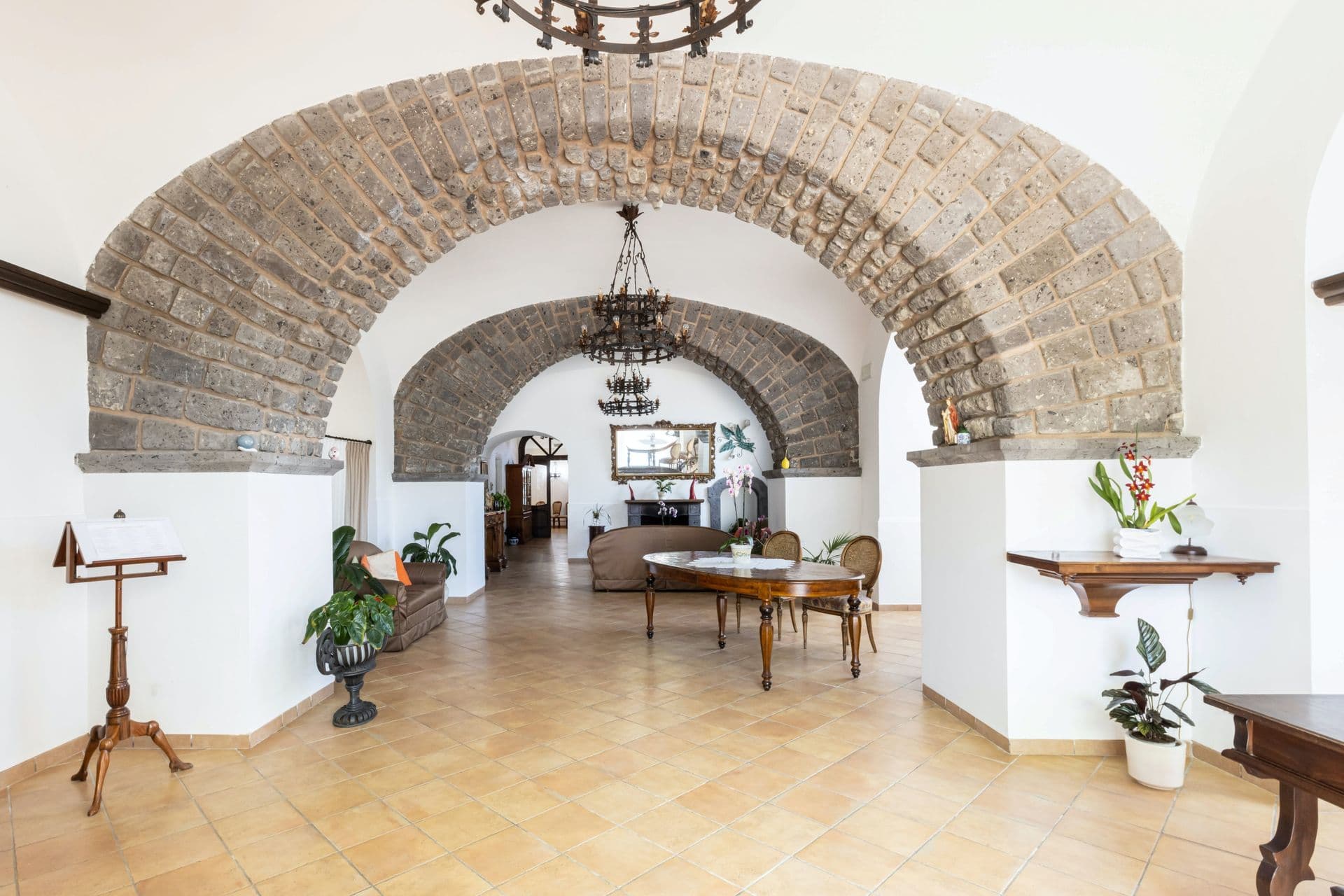 Vaulted stone hallway leading to the reception rooms at Pavillion Paradiso