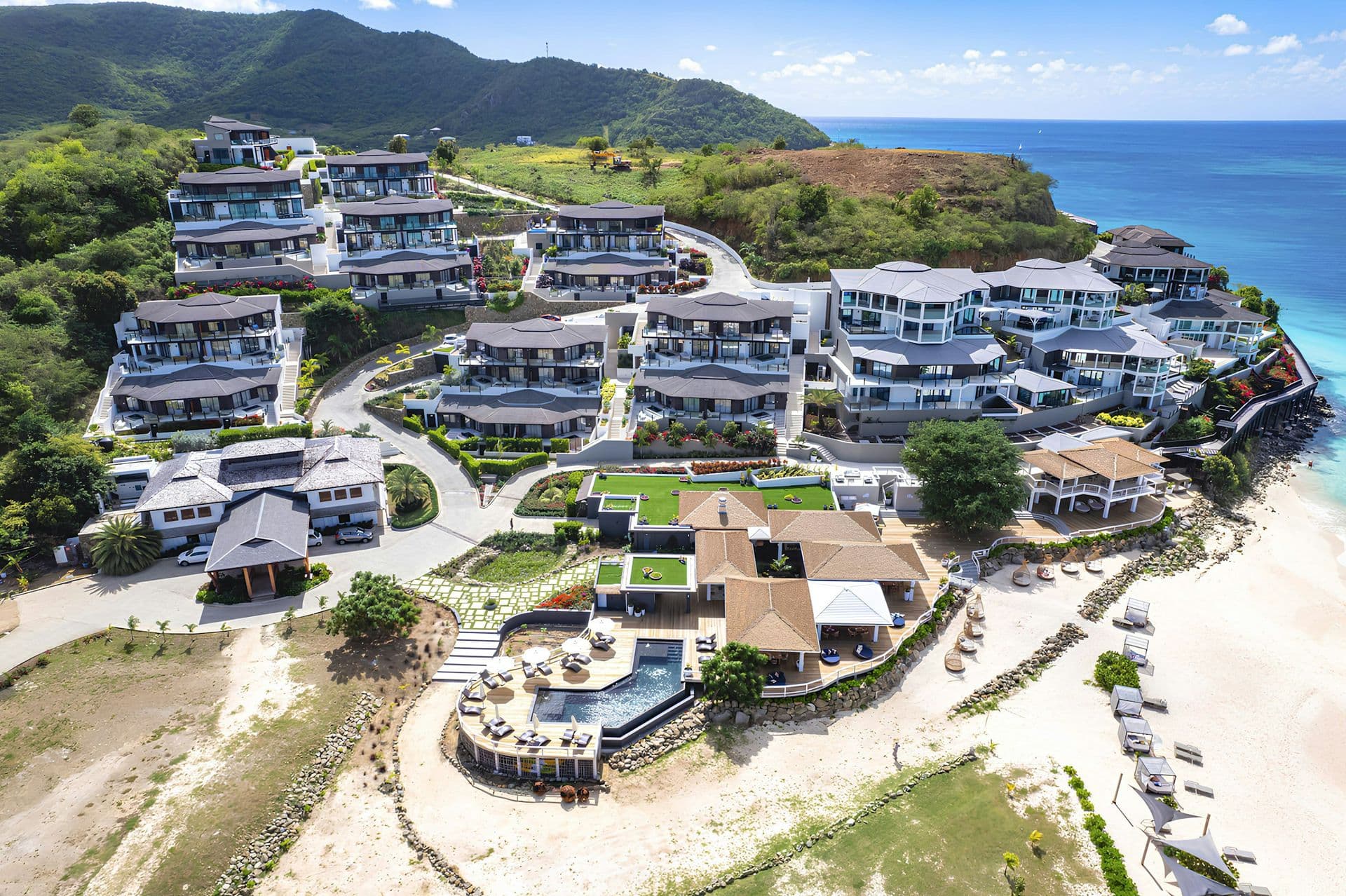 Aerial view of the resort villas along the coast at Life in the Palm, Antigua