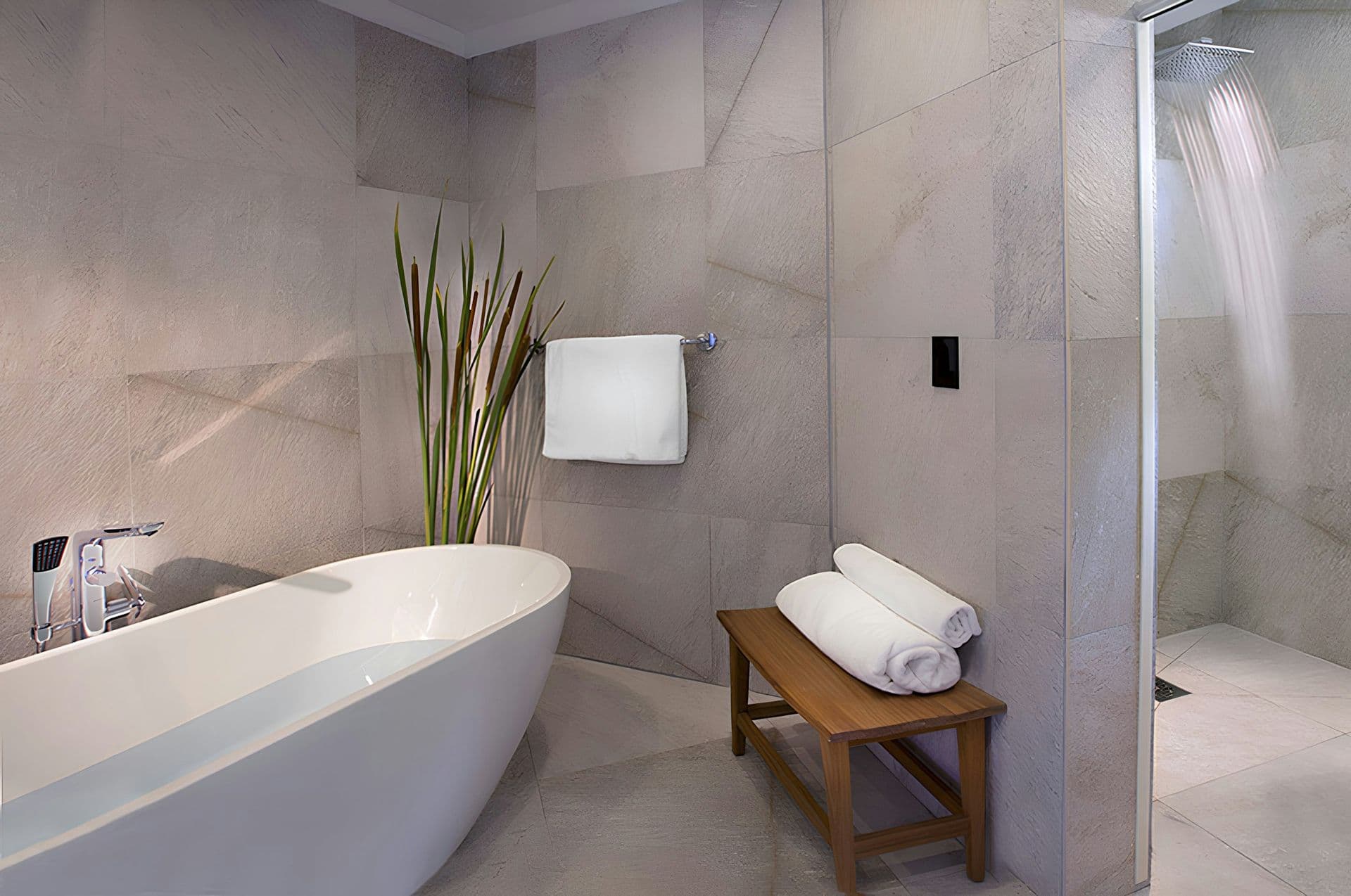 En-suite bathroom with a freestanding bath and walk-in shower at Life in the Palm