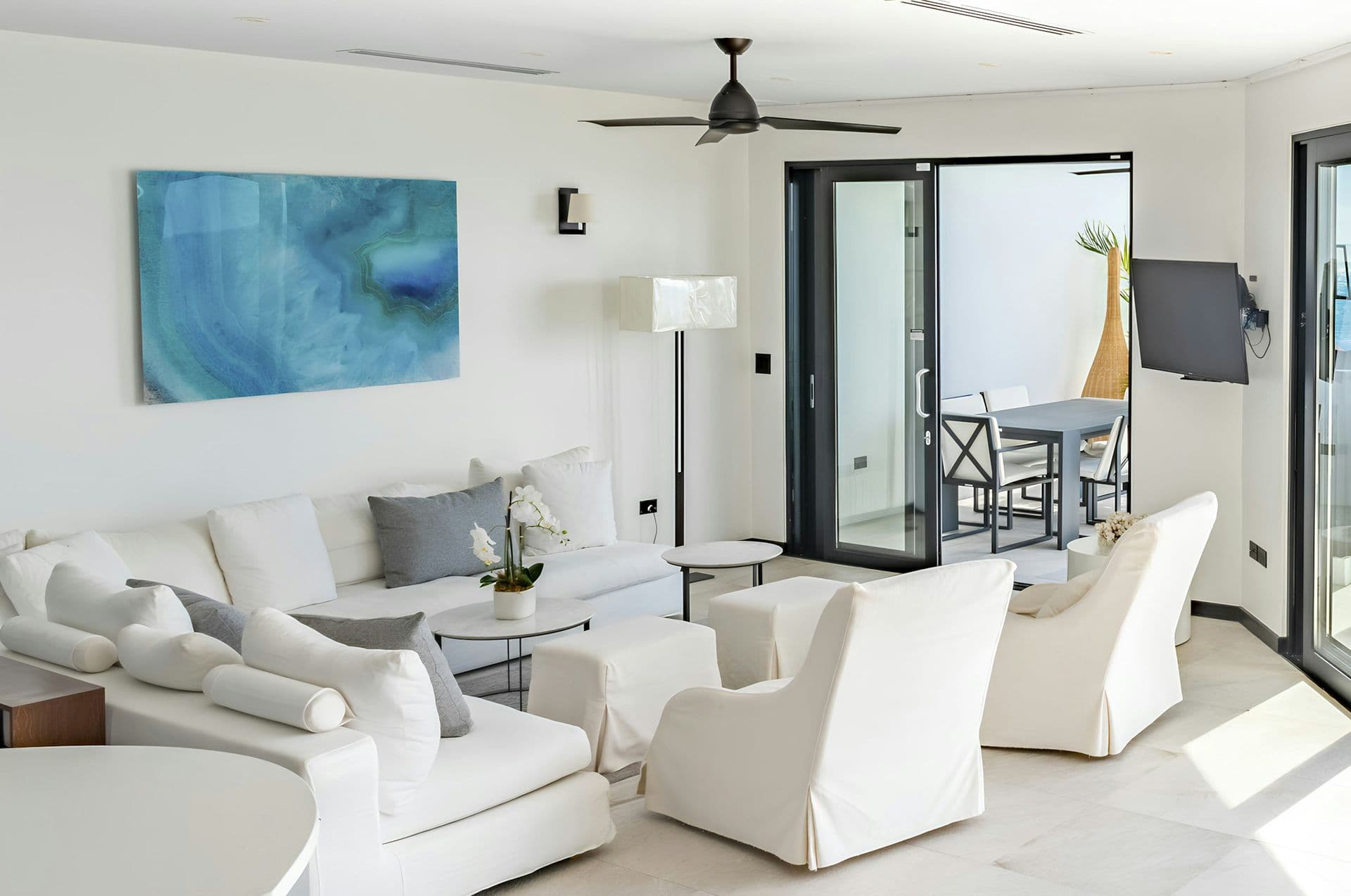 Bright white living room opening to the terrace at Life in the Palm, Antigua
