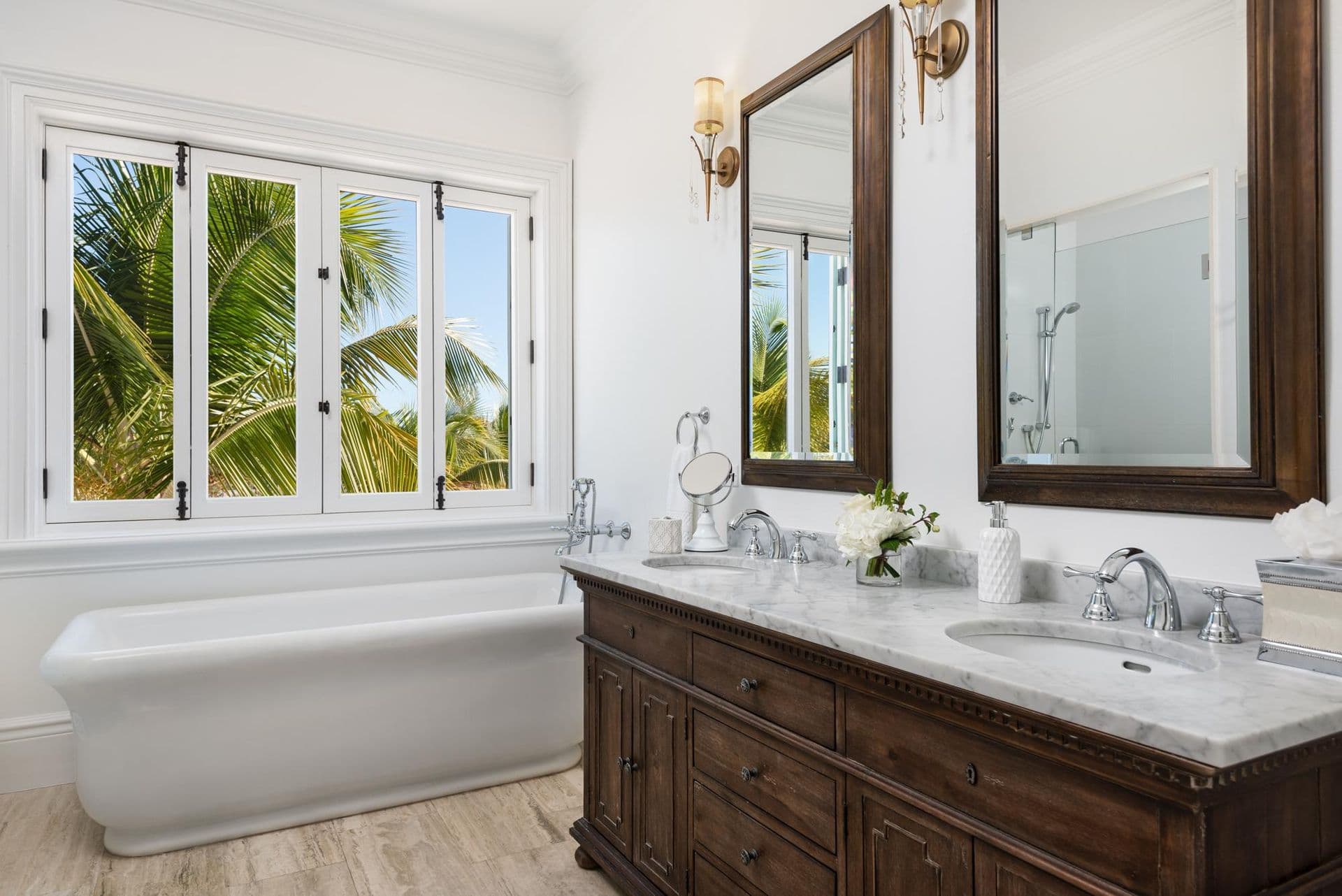 En-suite bathroom with freestanding tub and dark wood vanity