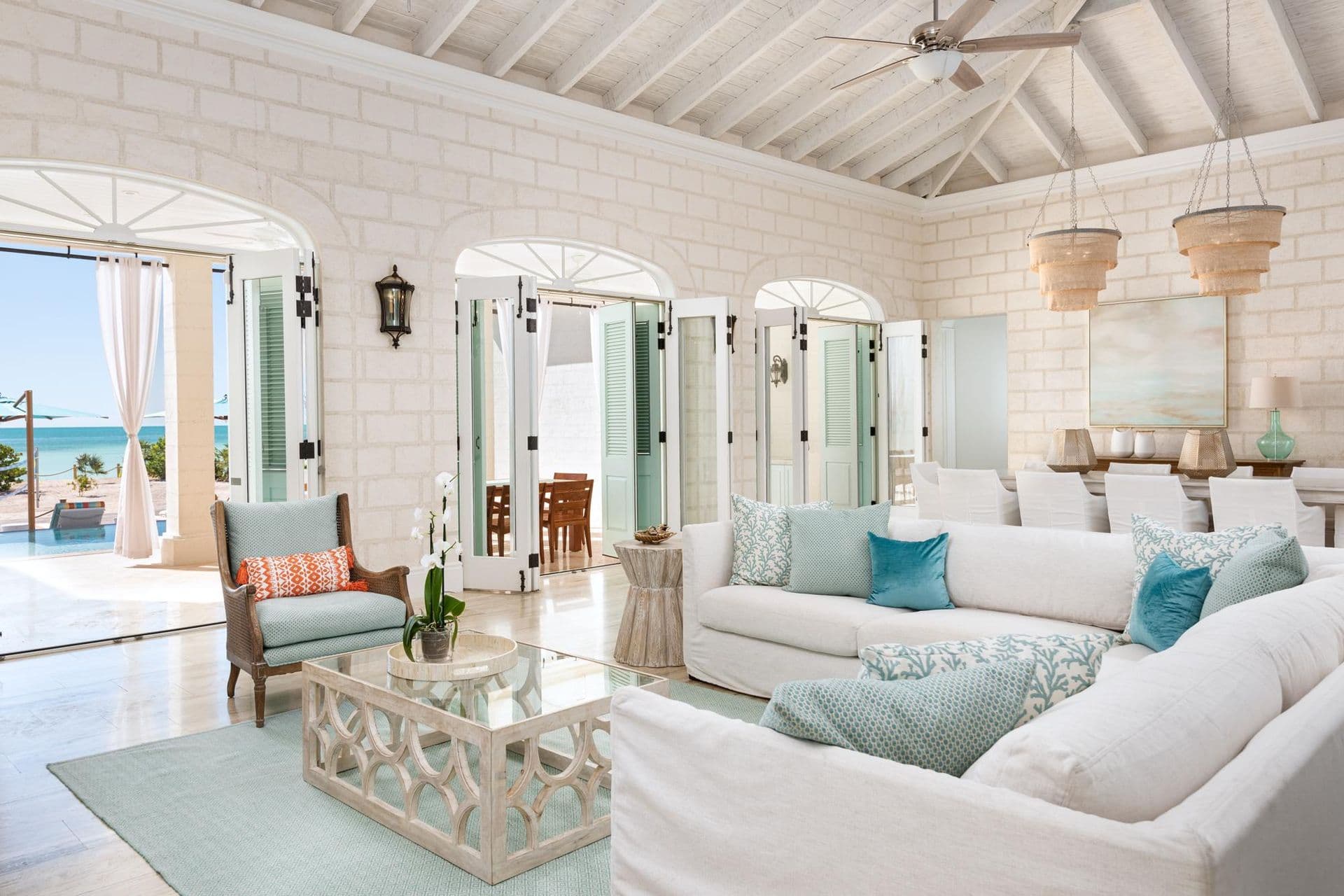 Open-plan great room with vaulted ceiling and beach views
