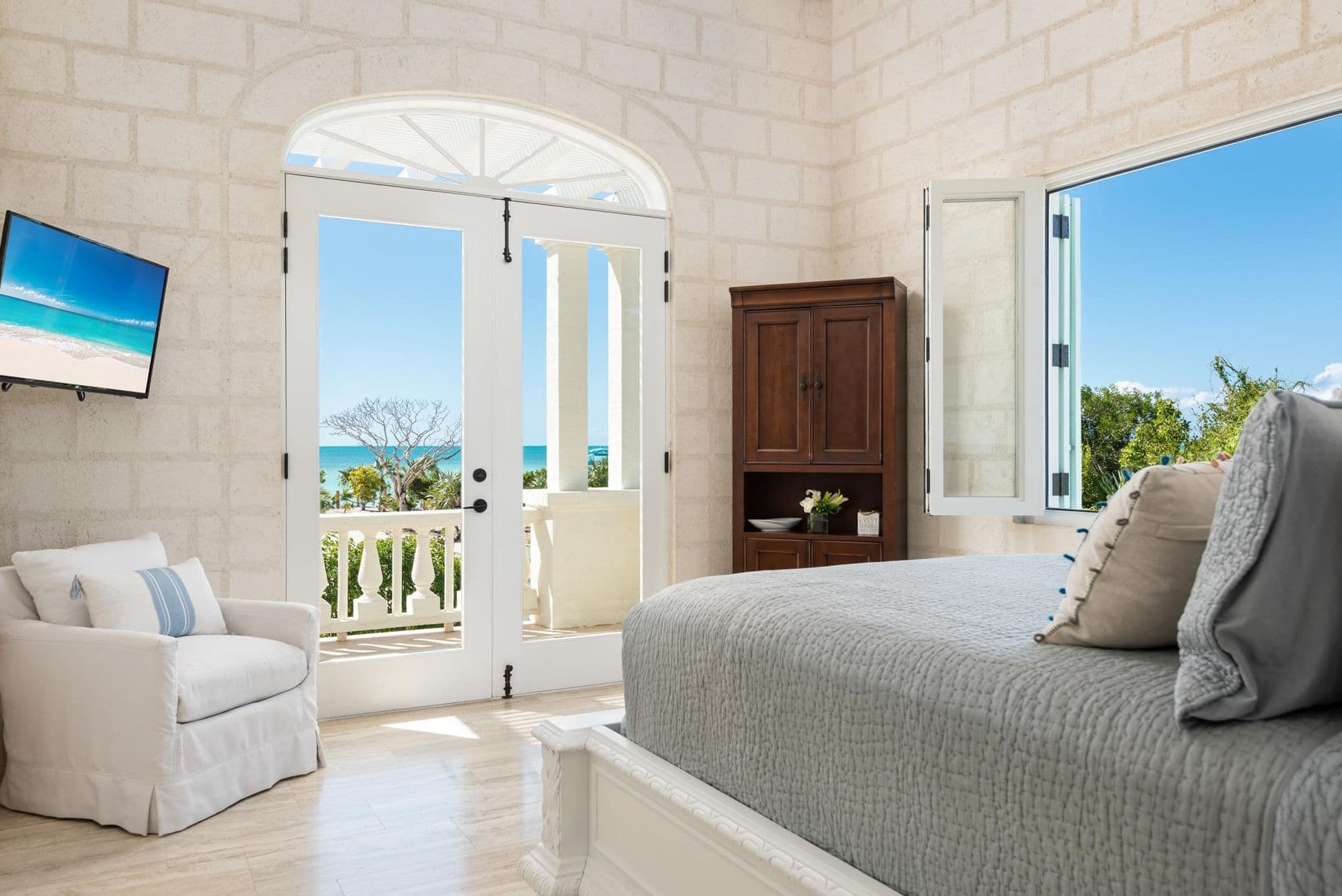 Guest bedroom with private balcony and sea views