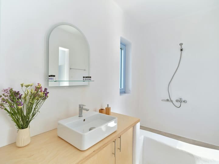 Dazzling View guest bathroom with wooden vanity, Paros, Cyclades Islands, Greece
