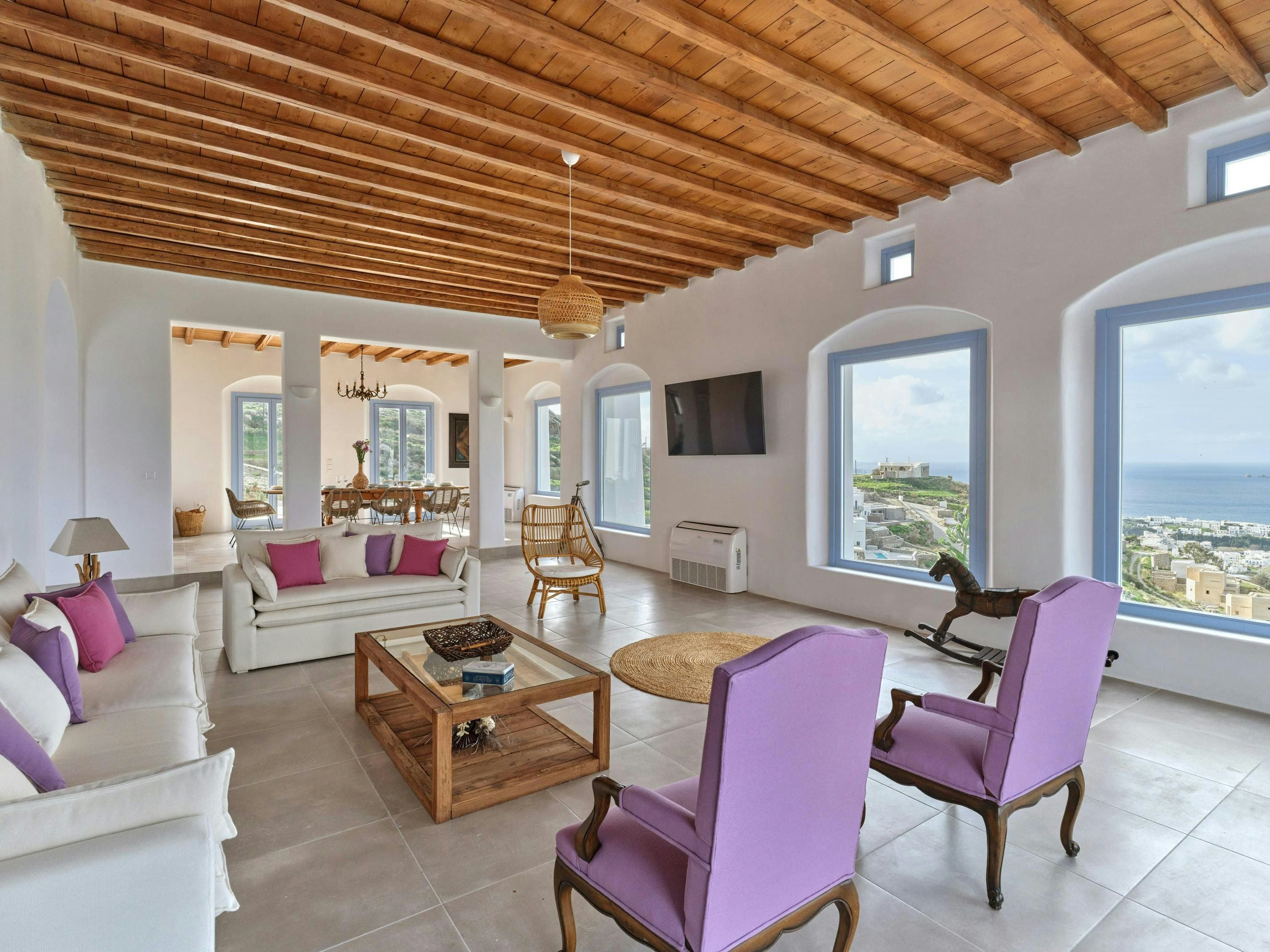 Dazzling View living room with arched windows and sea views, Paros, Cyclades Islands, Greece