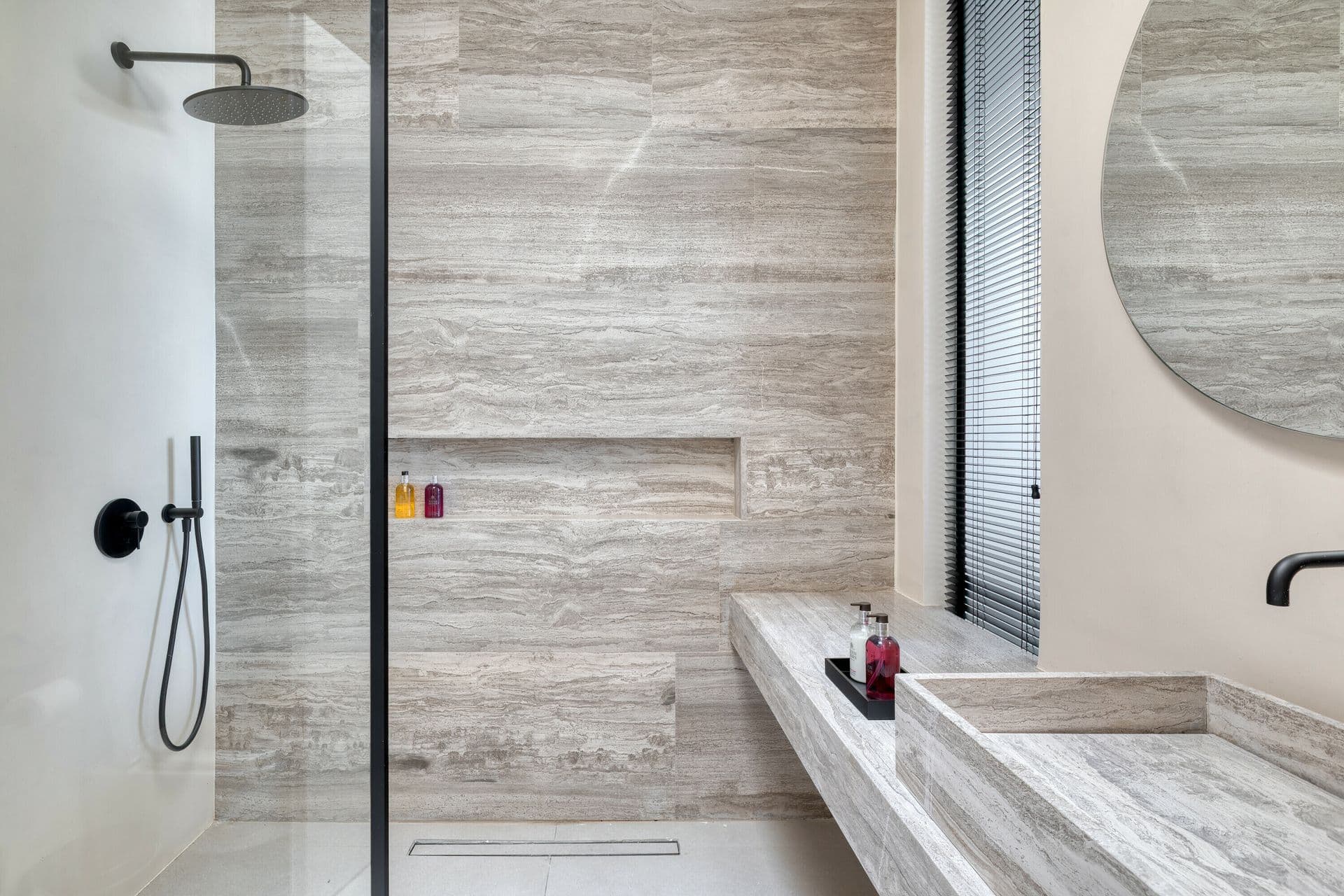 Travertine walk-in shower at Ocean Breeze & Sea Views, Mykonos