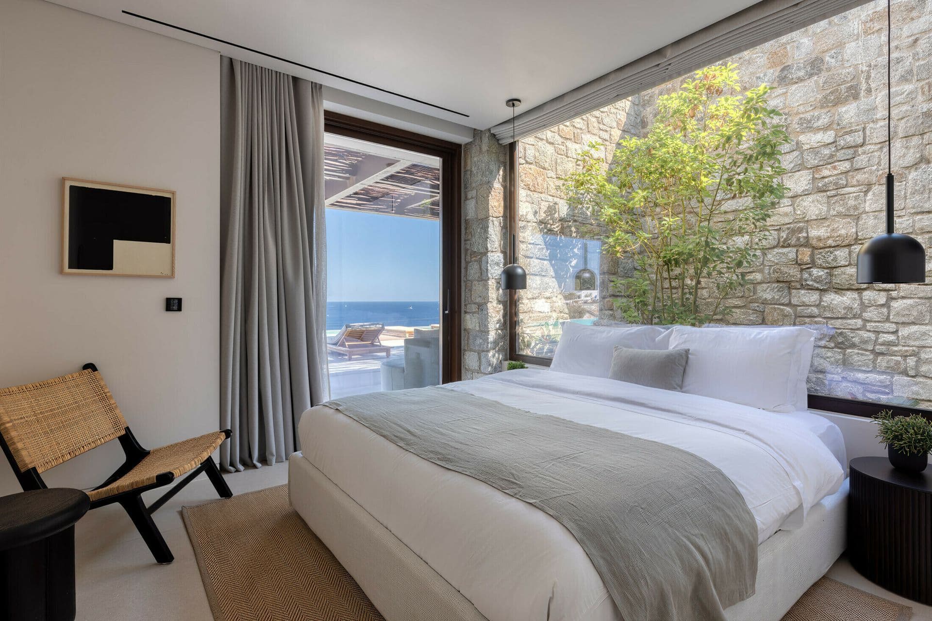 Bedroom with sea view window at Ocean Breeze & Sea Views, Mykonos