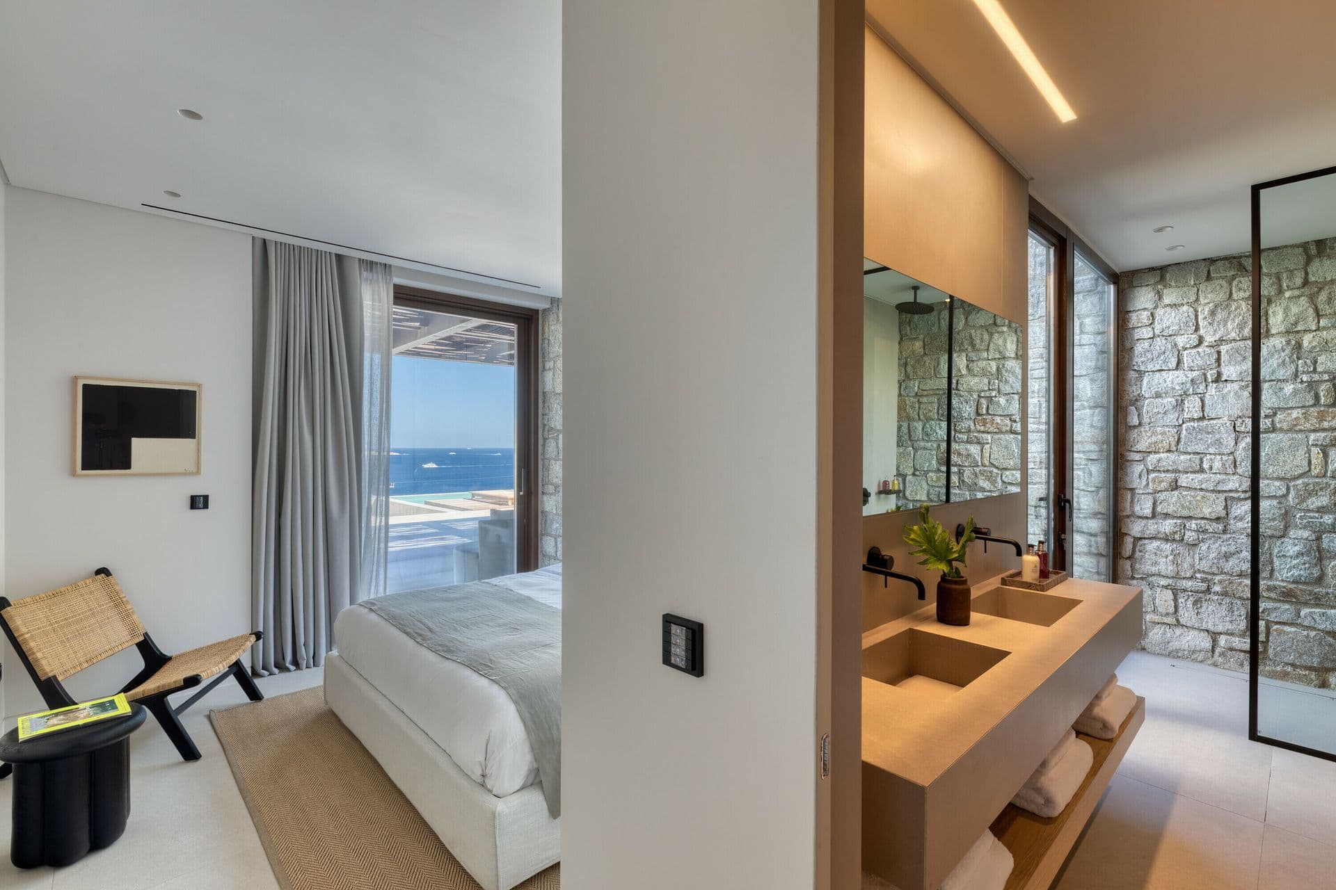Guest bedroom with artwork and reading nook at Ocean Breeze & Sea Views