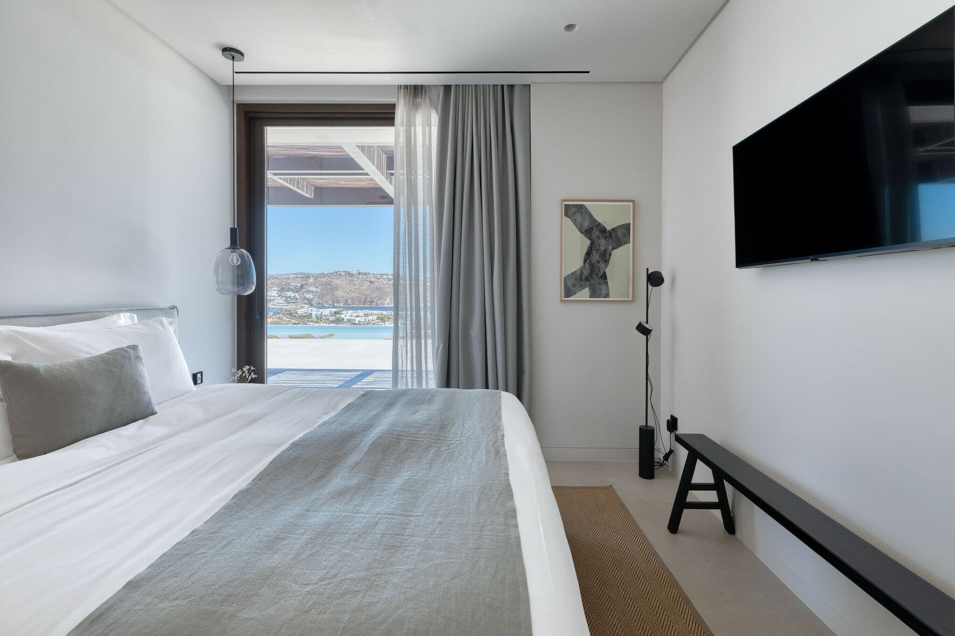 Guest bedroom with television at Ocean Breeze & Sea Views, Mykonos
