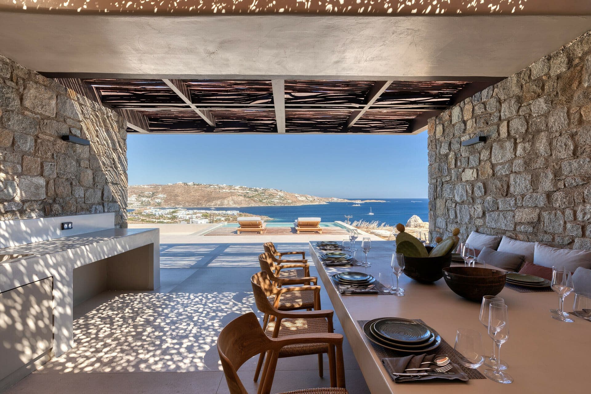 Covered outdoor kitchen and dining area at Ocean Breeze & Sea Views, Mykonos