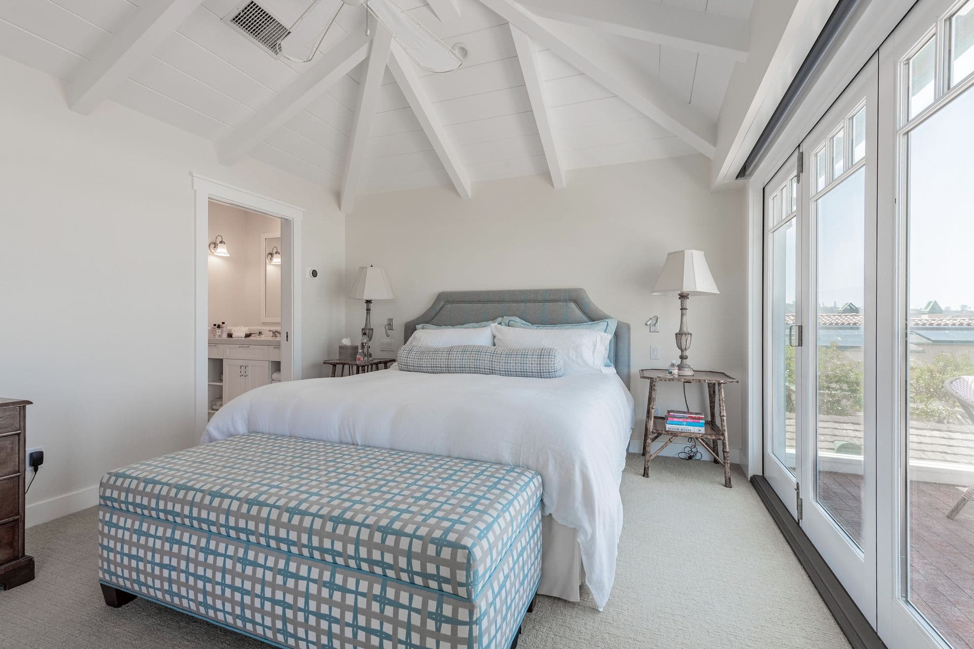 Bedroom with French doors opening to a balcony at Pearly Whites