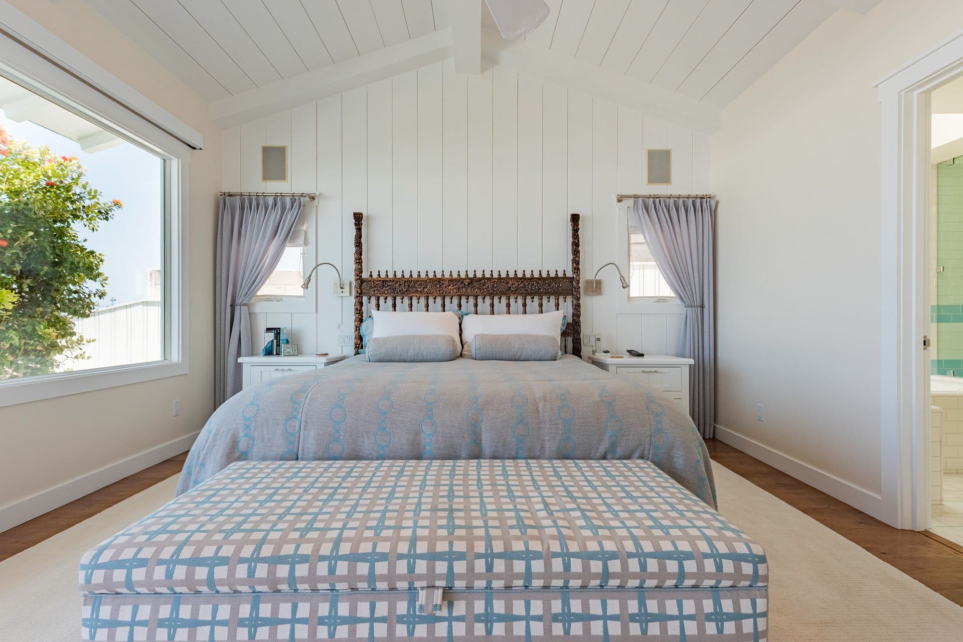 Bedroom with carved four-poster bed at Pearly Whites