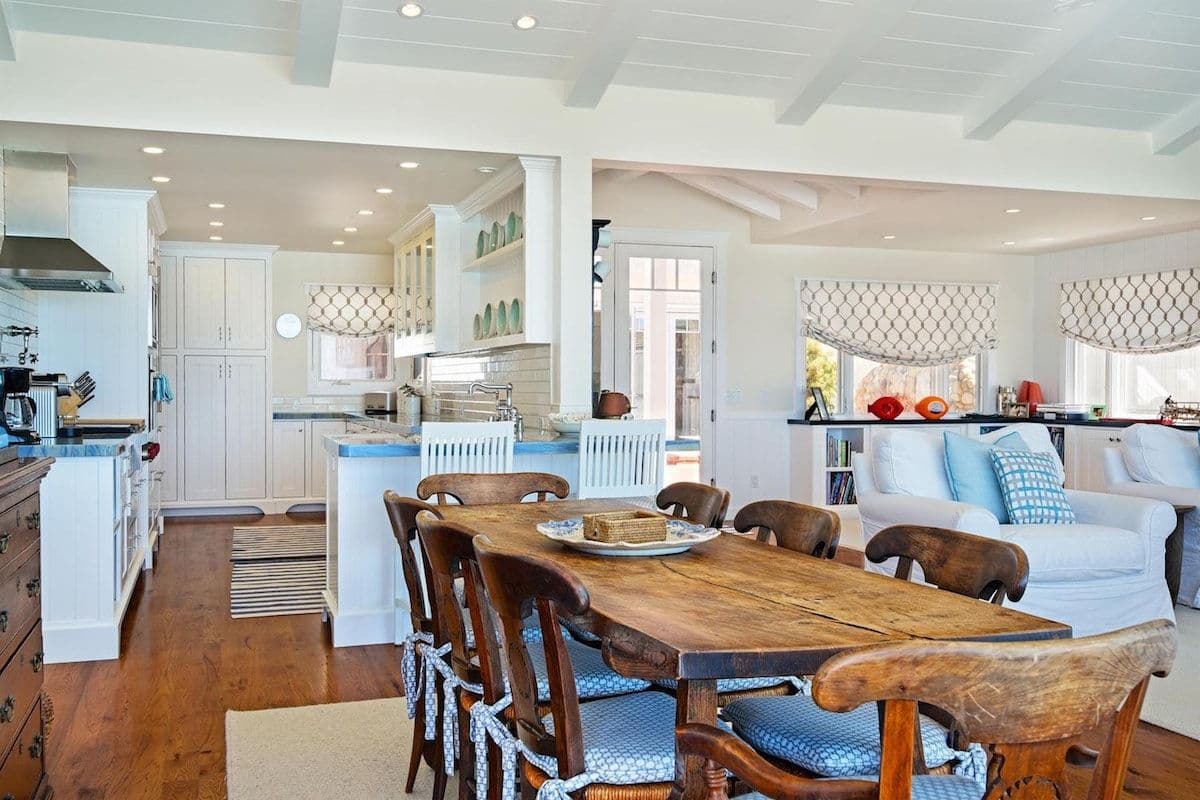 Farmhouse-style dining table beside the kitchen at Pearly Whites