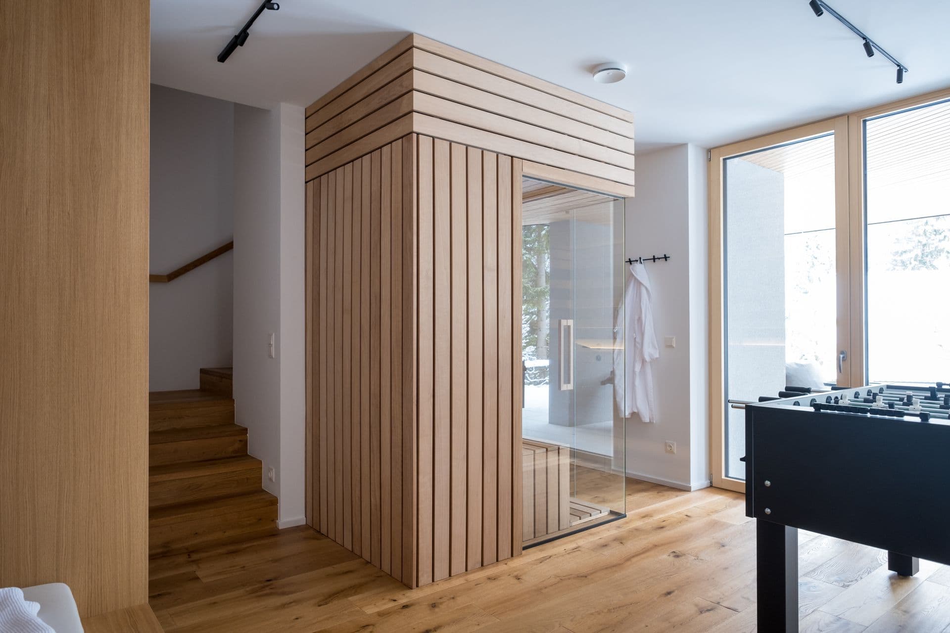 Timber-clad sauna cube built into the chalet's living space
